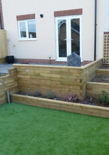 Multi-level new build garden design with steps and planters Multi-level new build garden design with steps and planters